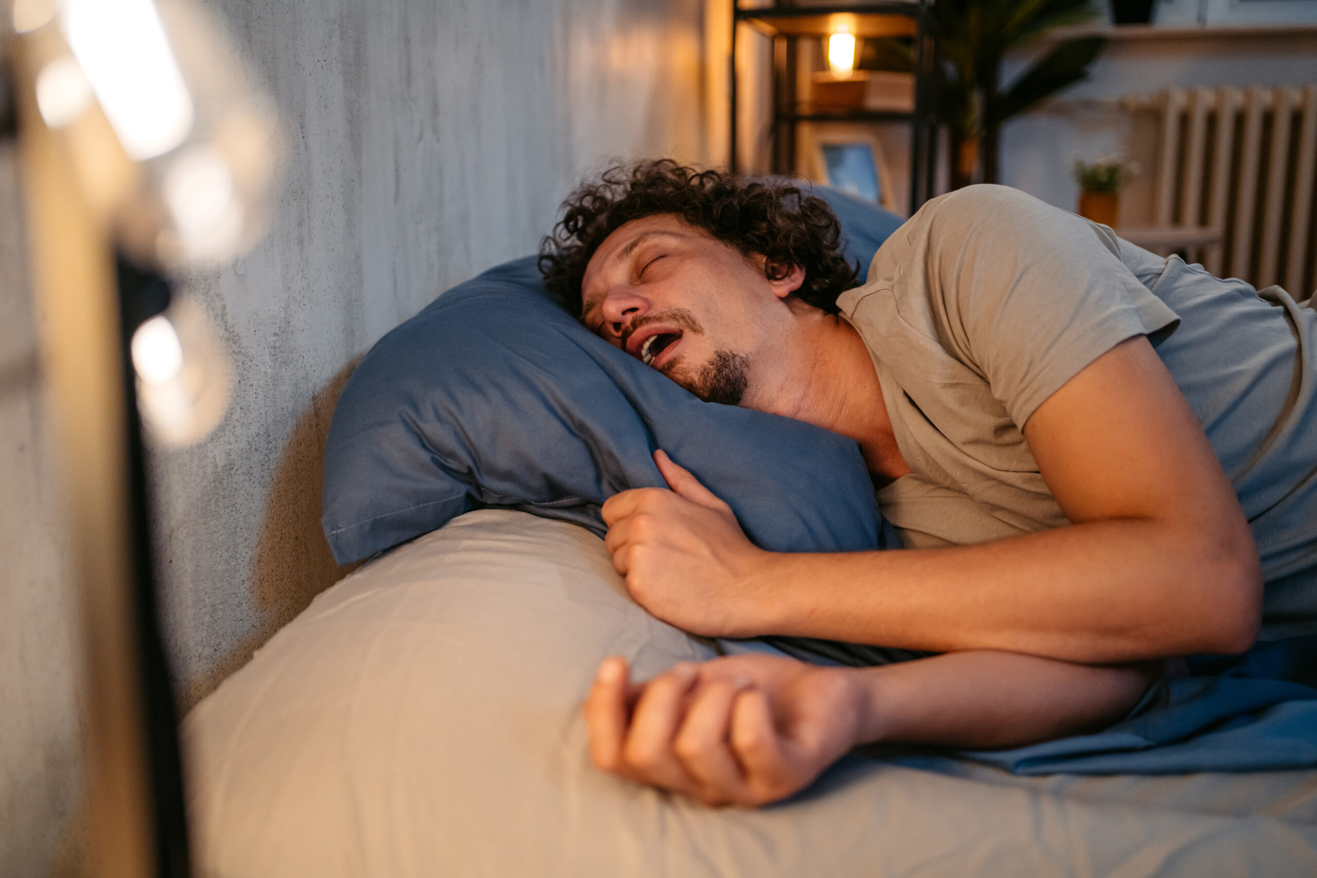  Man sleeping with Central Sleep Apnea