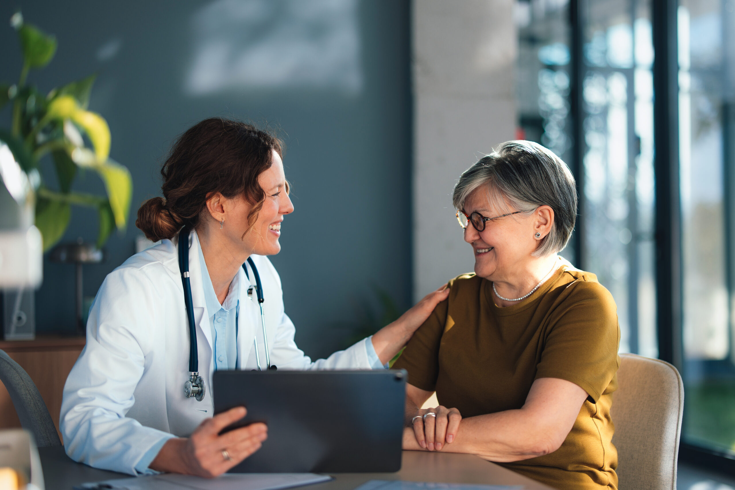 Physician talking with patient