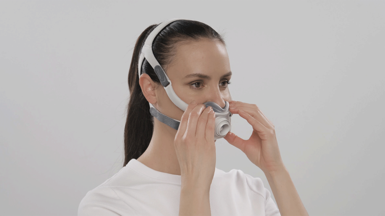 Woman fitting her Resmed AirTouch F40 mask